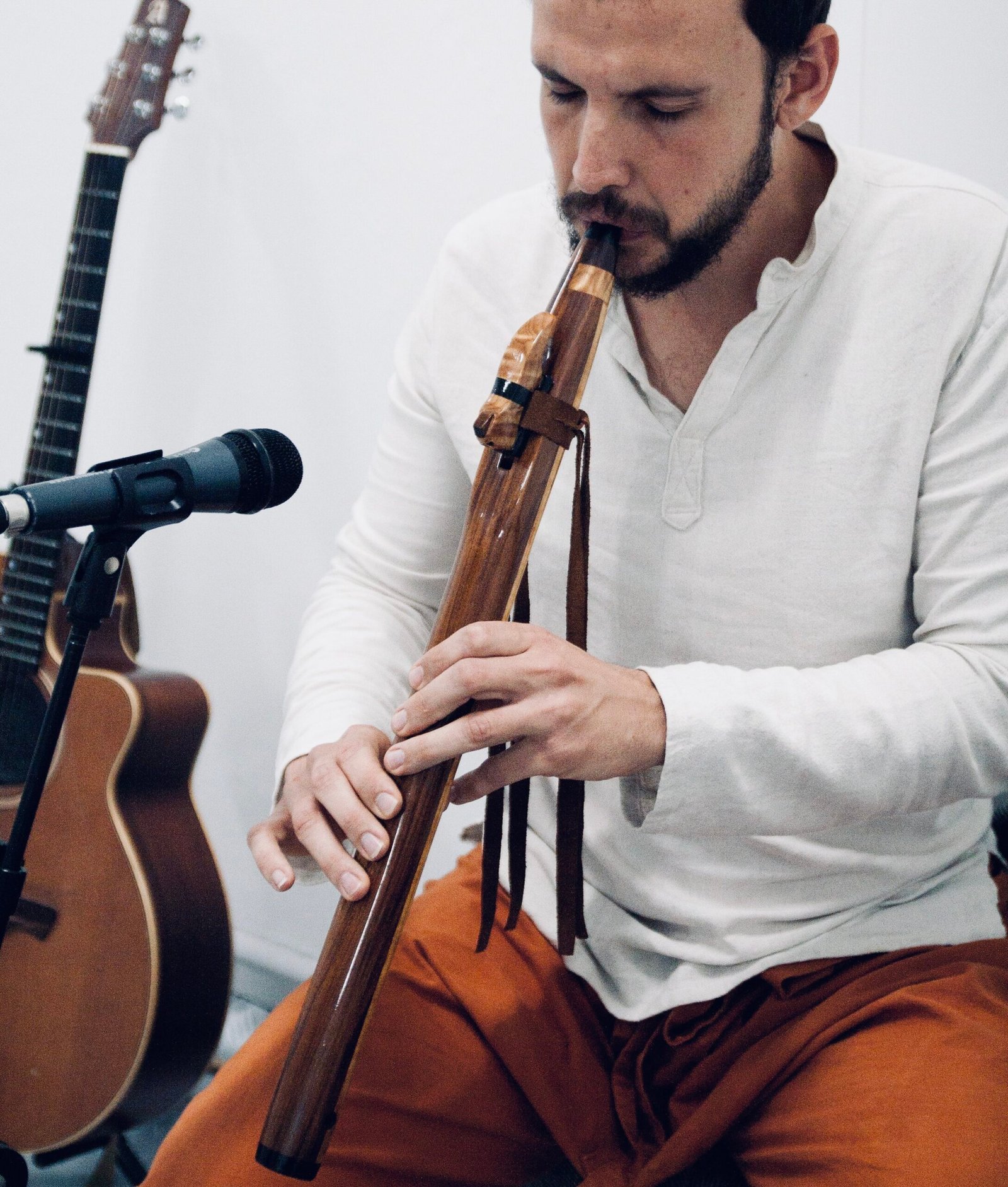 Daniel Espada playing native flute outdoors